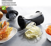 GEFU Spiral Slicer on a table with carrot noodles, showcasing its grating capabilities for creating vegetable noodles.