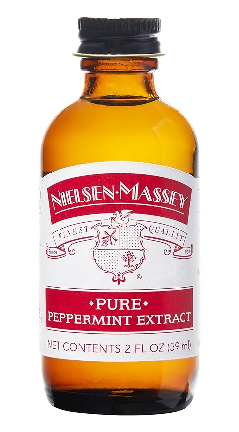 Nielsen-Massey Pure Organic Peppermint in a glass bottle, showcasing its label, perfect for enhancing culinary creations from Athens Cooks.