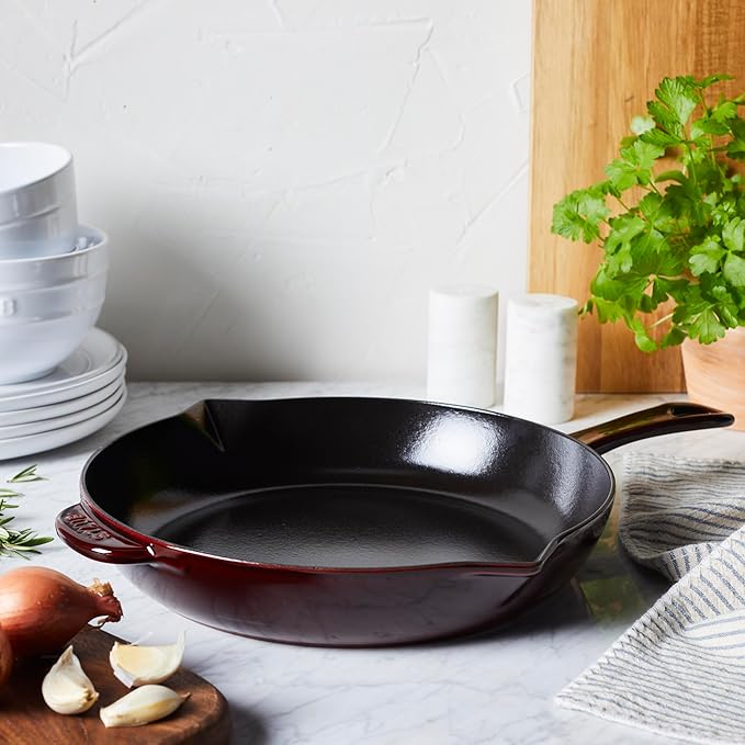 Staub Cast Iron Frying Pan - Grenadine, ideal for versatile cooking, showcasing durable craftsmanship, available at Athens Cooks, a curated kitchen tools destination.