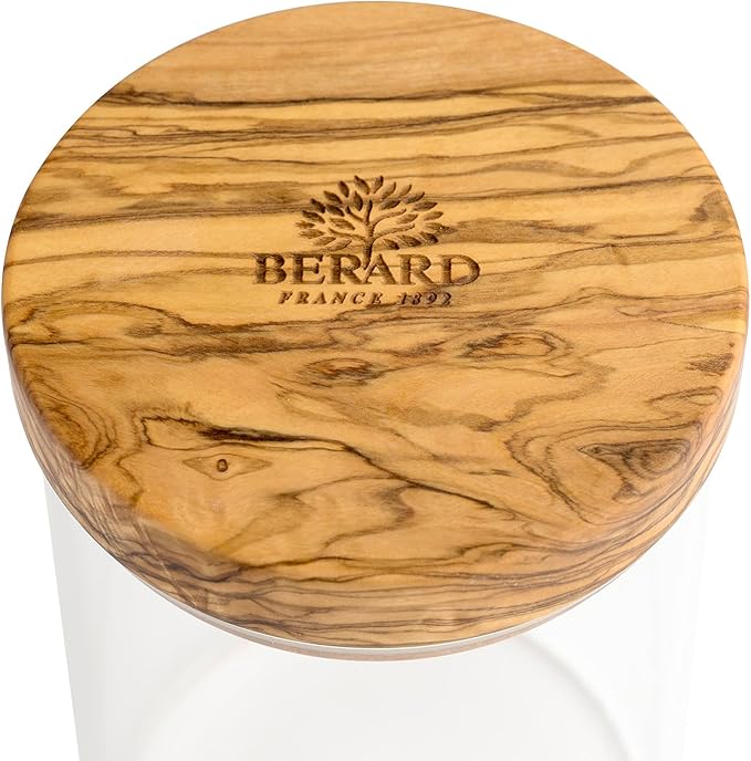 Browne & Co | BERARD Glass Jar w/Lid 4x6 features a sleek glass container topped with a wooden lid, ideal for storing kitchen essentials.