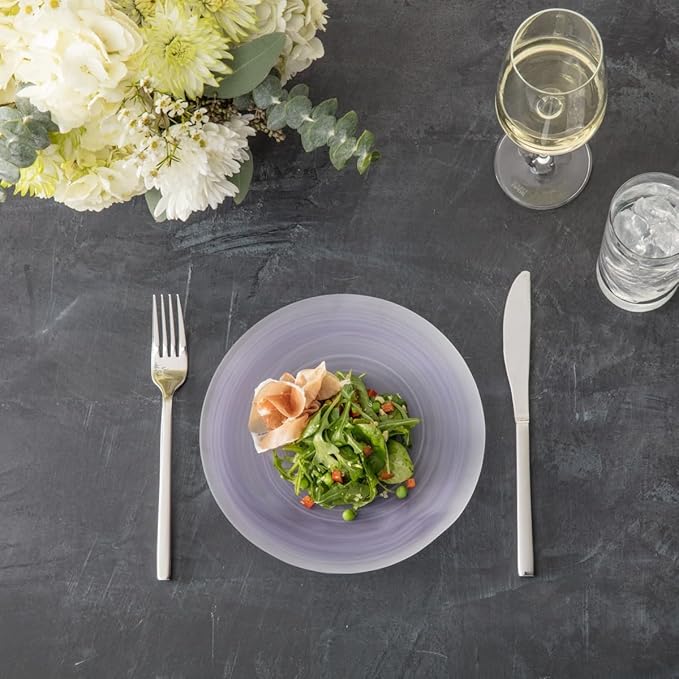 Fortessa | Arezzo 60 piece Place Setting elegantly displayed with a plate of salad and glasses of wine and water, suggesting a refined dining experience.