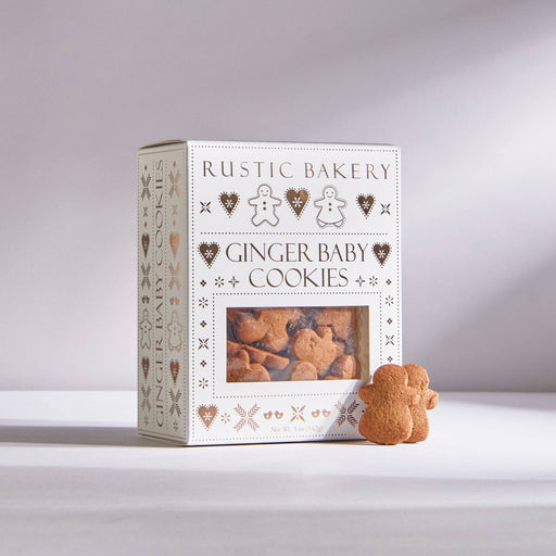 Rustic Bakery - Ginger Baby Cookies in a decorative box with two gingerbread-shaped cookies visible. Includes 12 boxes, perfect for festive indulgence.