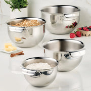 Stainless steel mixing bowl set by Hestan, featuring sizes 1.5qt, 3.0qt, 4.75qt, and 7.0qt, filled with various ingredients.