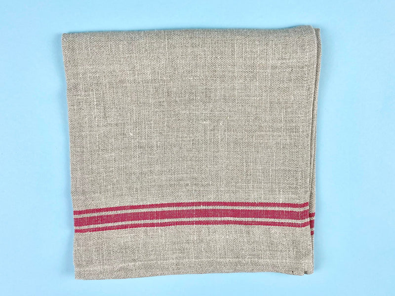 Thieffry | Monogramme Linen Tablecloth close-up showcasing intricate weave and texture, emphasizing luxurious craftsmanship and durability, ideal for enhancing dining experiences.