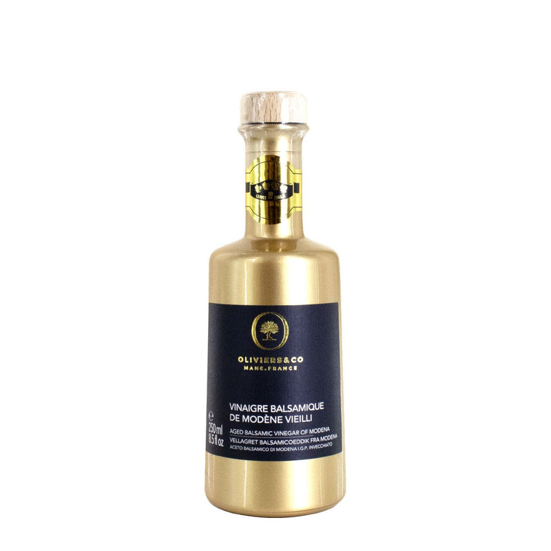 Oliviers&Co | Aged Balsamic Vinegar of Modena in a distinctive gold bottle with a black label, ideal for culinary enthusiasts at Athens Cooks.