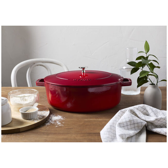 Staub | Wide Oval Dutch Oven - Graphite Grey, featuring a wide oval shape, ideal for braising and baking with self-basting lid for flavorful cooking.