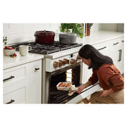 Staub Round Cocotte, 4 qt, Grenadine: A versatile cast iron pot with self-basting lid, perfect for slow-cooking and serving from kitchen to table.