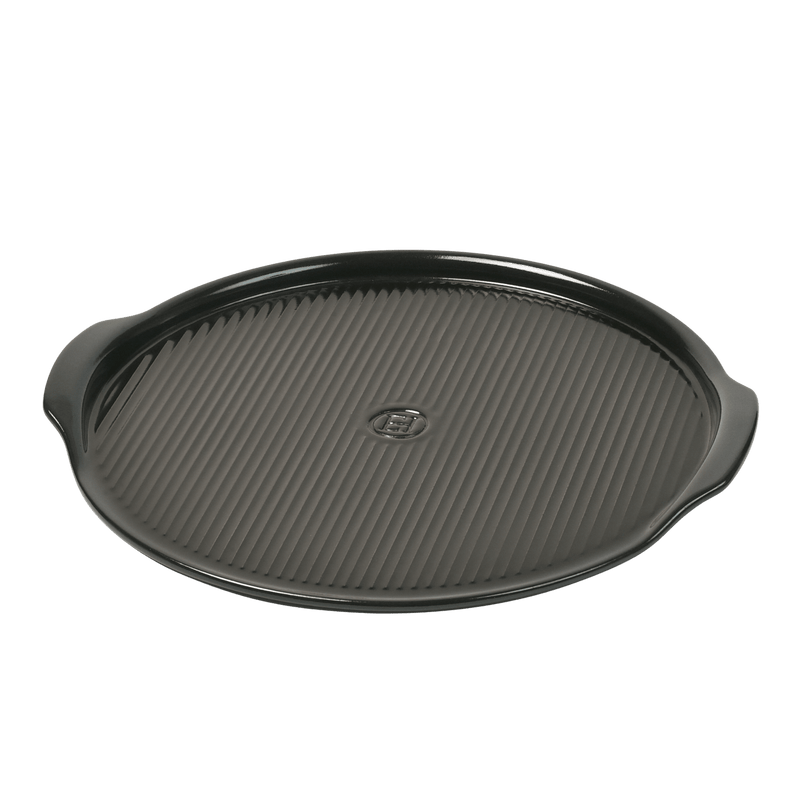 Emile Henry Ridged Pizza Stone, Charcoal, with integrated handles, suitable for achieving brick oven-quality pizza crusts at home, ideal for stovetop or oven use.