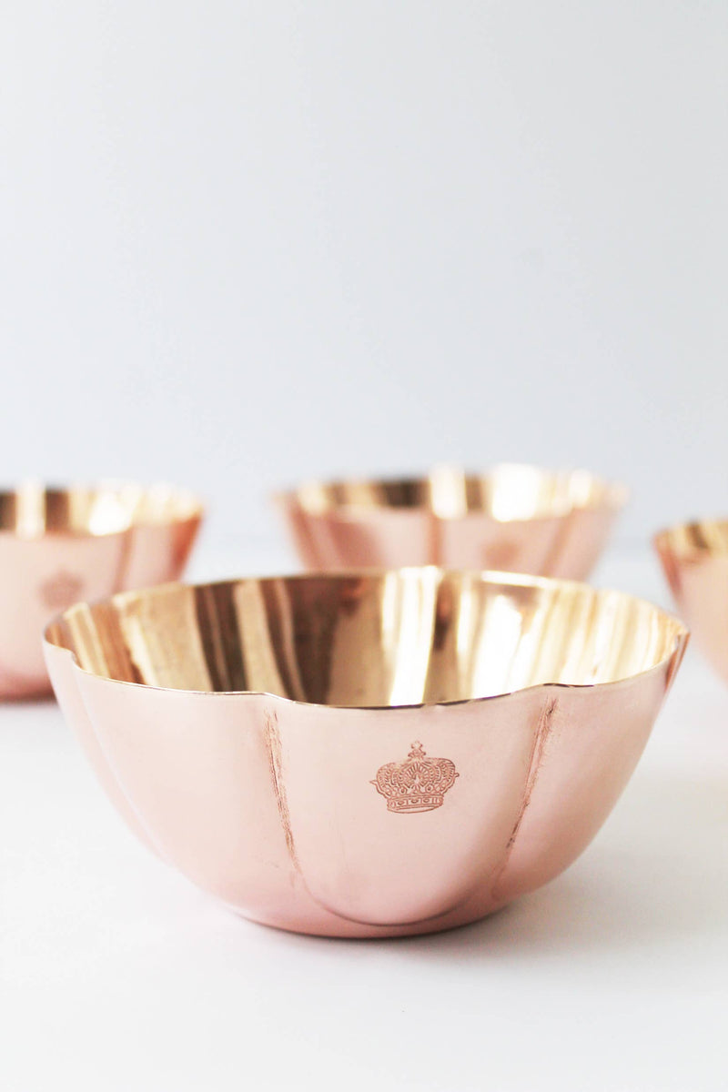 Copper bowl with scalloped rim and crown engraving from Coppermill Kitchen LLC, part of Athens Cooks' vintage collection, showcasing European elegance and durability for serving or decor.