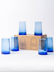 Set of six Moroccan Cone Glassware, hand-blown with visible bubbles, crafted from recycled bottles, showcasing artisanal skill. Ideal for beverages or as decorative vases.