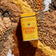 Diaspora Co. Spices - Popcorn Masala can on a spice blend, showcasing gourmet ingredients for enhancing popcorn with cheese, umami, and earthy flavors.