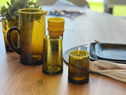 Moroccan Cone Glassware Small - Amber - Set of 6 showcases hand-blown, cone-shaped glasses, highlighting artisan craftsmanship with organic forms and bubbles in recycled glass.