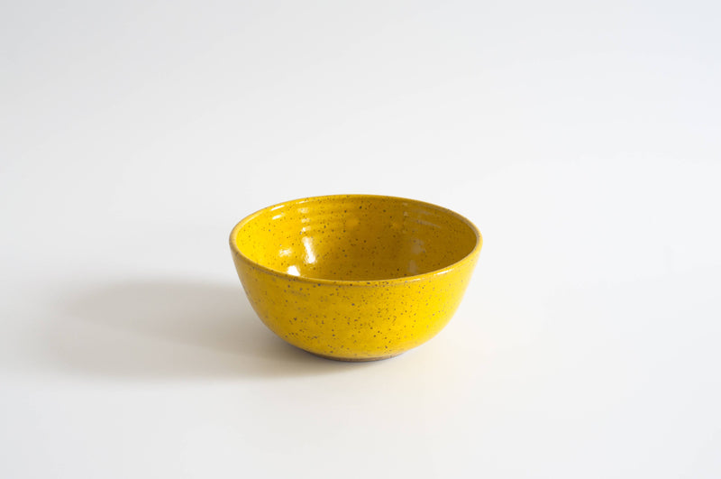 RachaelPots - Breakfast Bowl: Sage, a hand-thrown, speckled ceramic bowl, ideal for cereals or ice cream, made from domestic stoneware, sits on a white surface.