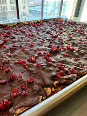 Norwegian Baked - KnekkeGodis, a Nordic cookie toffee bark, featuring crispbread with caramel, dark chocolate, cranberries, and sea salt.