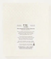 Three Bluebirds Swedish Dishcloth - Amber Garden, featuring sustainable paper with black text, ideal for eco-friendly kitchen cleaning, available at Athens Cooks.