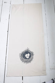 Hearth and Harrow - Nest Tea Towel: A large organic cotton towel with a dark blue bird's nest design, perfect for kitchen or dining use.