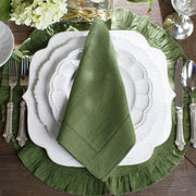 Bella Bianca Beaded Dinner Plate on a table setting with a green napkin and elegant tableware, showcasing its intricate Italian stoneware design and craftsmanship.