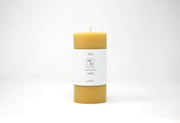 Mo&Co Home - 100% Beeswax Pillar Candle, 3x6 Inch, with a white label, showcasing a hand-poured design for eco-friendly, clean burning.