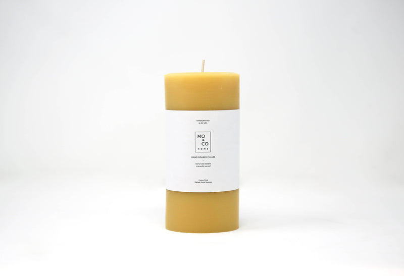 Mo&Co Home - 100% Beeswax Pillar Candle, 3x6 Inch, with a white label, showcasing a hand-poured design for eco-friendly, clean burning.