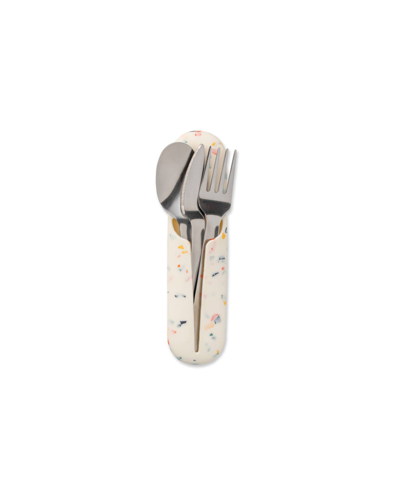 W&P - Stainless Steel Utensils Set in Silicone Carry Case: Terrazzo Charcoal, featuring a spoon, fork, and knife in a compact silicone holder for easy transport.