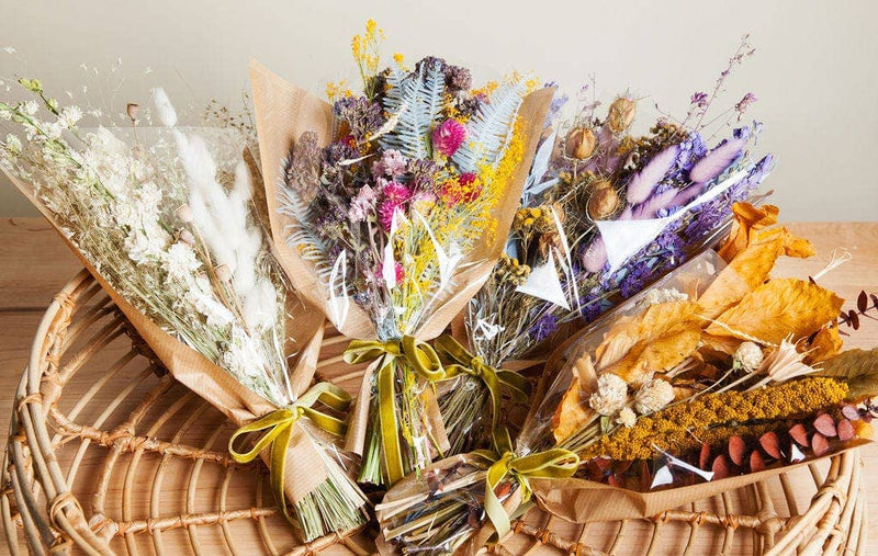Idlewild Floral Co. - Christmas Mini Market Bouquet features colorful dried flowers in kraft paper, perfect as lasting, maintenance-free decor for any space.