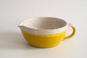 RachaelPots - Salad Dressing Bowl: Pink, a versatile yellow and white speckled ceramic bowl with a garlic scraper, handle, and pour spout, perfect for dressings or guacamole.