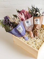 Giften Market - Wooden Gift Box Luxury Pine Keepsake with Lid - 10x10x5, featuring a crafted pine box filled with dried flower bouquets wrapped in pastel paper.