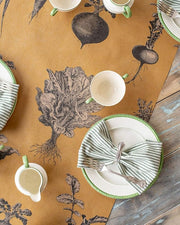 Hester & Cook | Farmer's Market Runner displayed on a table with ceramic dishware and utensils, capturing an elegant culinary setting.