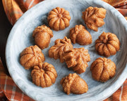 Nordic Ware | Autumn Delights Pan showcasing detailed mini cakelets shaped like acorns, maple leaves, and pumpkins, perfect for baking 12 charming autumn-themed treats.