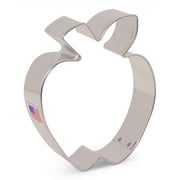 Ann Clark's metal apple-shaped cookie cutter, ideal for enhancing baking creativity; crafted in Vermont, perfect for festive treats and available at Athens Cooks.