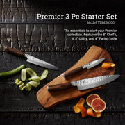 Shun | Premier Starter Set, Walnut, 3-Piece: Three Japanese-style knives on a cutting board with fresh produce, showcasing an 8 chef's, 6.5 utility, and 4 paring knife.