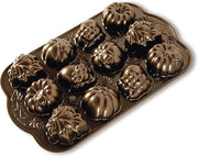 Nordic Ware | Autumn Delights Pan featuring intricate acorn, maple leaf, and pumpkin molds for baking 12 detailed mini treats, crafted from durable cast aluminum.