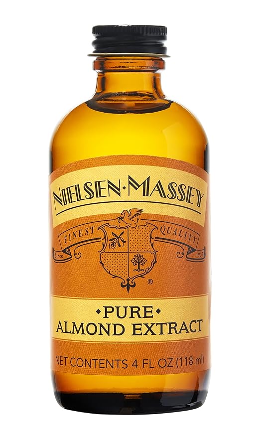 Nielsen-Massey Pure Almond Extract in a glass bottle, featured at Athens Cooks, ideal for enhancing flavors in baking and cooking.