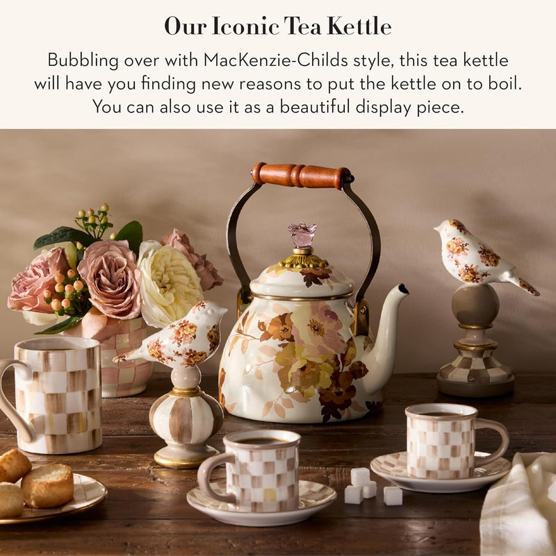 Mackenzie Childs | White Wild Rose Tea Kettle, 2 QT., with floral pattern, wooden handle, and crystal lid, surrounded by elegant tea-time items on a rustic table.