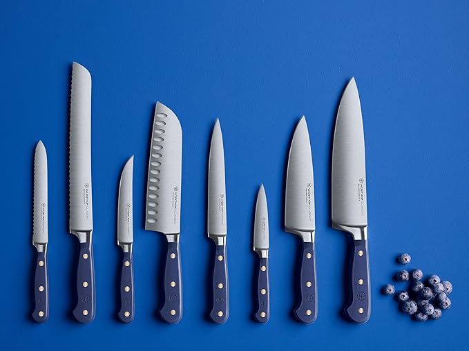 Wüsthof Classic 7 Hollow Edge Santoku Wild Blueberry, featuring distinct blue handles, ideal for precise kitchen tasks, available at Athens Cooks.