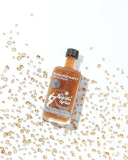 Runamok Mini Sparkle Syrup in a glass bottle, displayed on a white surface, ideal for culinary enthusiasts at Athens Cooks kitchen store.