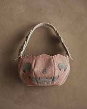 Coral & Tusk - Jack-o'-Lantern Basket, a stitched fabric tote resembling a smiling pumpkin, perfect for Halloween treats with intricate embroidery and appliquéd leaves.