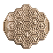 Nordic Ware | Honeycomb Pull-Apart Pan featuring a honeycomb and bee pattern, ideal for creating 19 perfectly portioned cakelets inspired by buzzing bees.