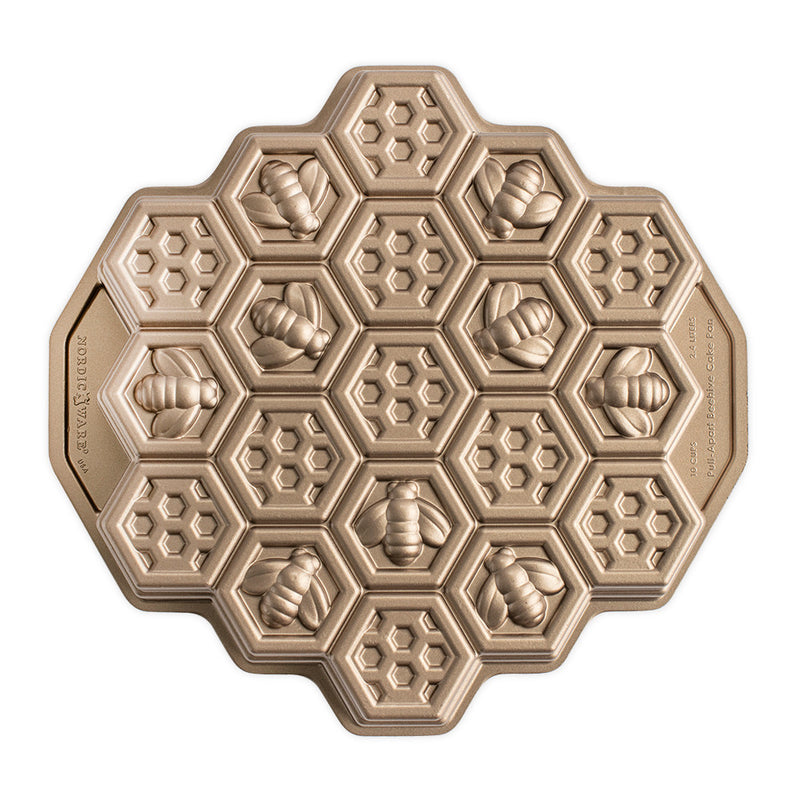 Nordic Ware | Honeycomb Pull-Apart Pan featuring a honeycomb and bee pattern, ideal for creating 19 perfectly portioned cakelets inspired by buzzing bees.