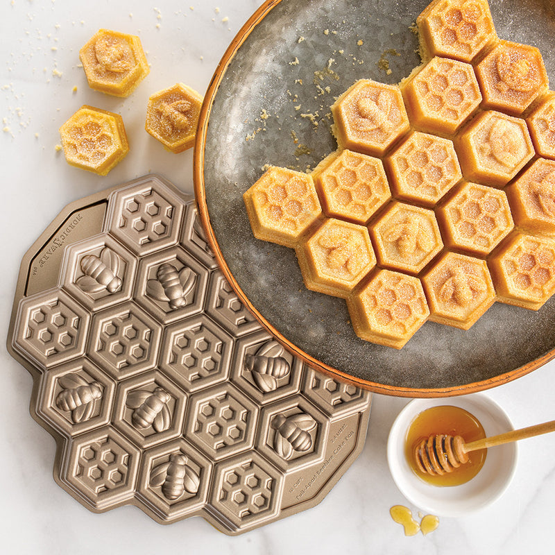 Nordic Ware | Honeycomb Pull-Apart Pan, featuring honeycomb-shaped sections for creating 19 perfectly portioned cakelets, ideal for themed baking projects.