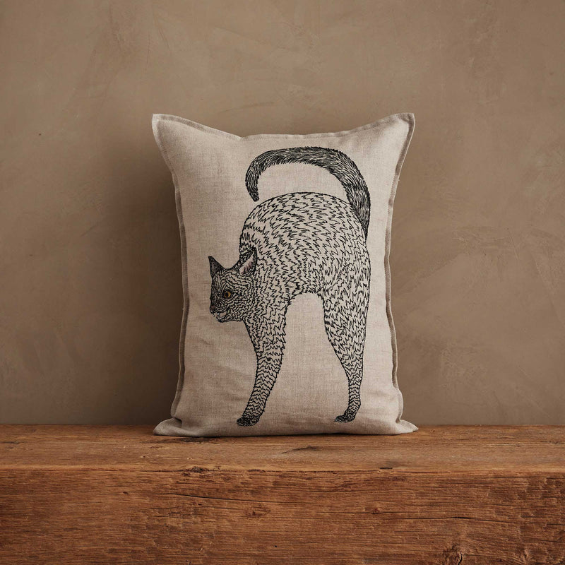 Coral & Tusk - Scaredy Black Cat Pillow: Linen-look pillow featuring an arched black cat with gold eyes, perfect for adding a whimsical touch to your decor.