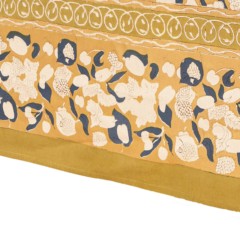 Couleur Nature - Forest Harvest Mustard & Blue tablecloth, featuring hand-printed white fruit and navy-blue leaf motifs on mustard-yellow, inspired by Provençal forests, 71 x 71.