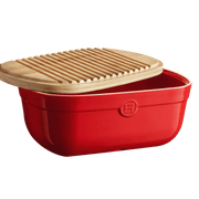 Emile Henry | Bread Box, Burgundy: Red ceramic box with a bamboo lid, doubling as a cutting board, designed to keep bread fresh with moisture-balancing properties.