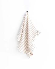 MagicLinen ruffle trim tea towel on a hook, 100% linen, designed for style and functionality in the kitchen.