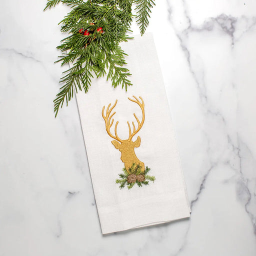 Golden Stag Towel by Arte Italica & Crown Linen Designs, showcasing an embroidered stag head with pine details on white linen, perfect for kitchen elegance.