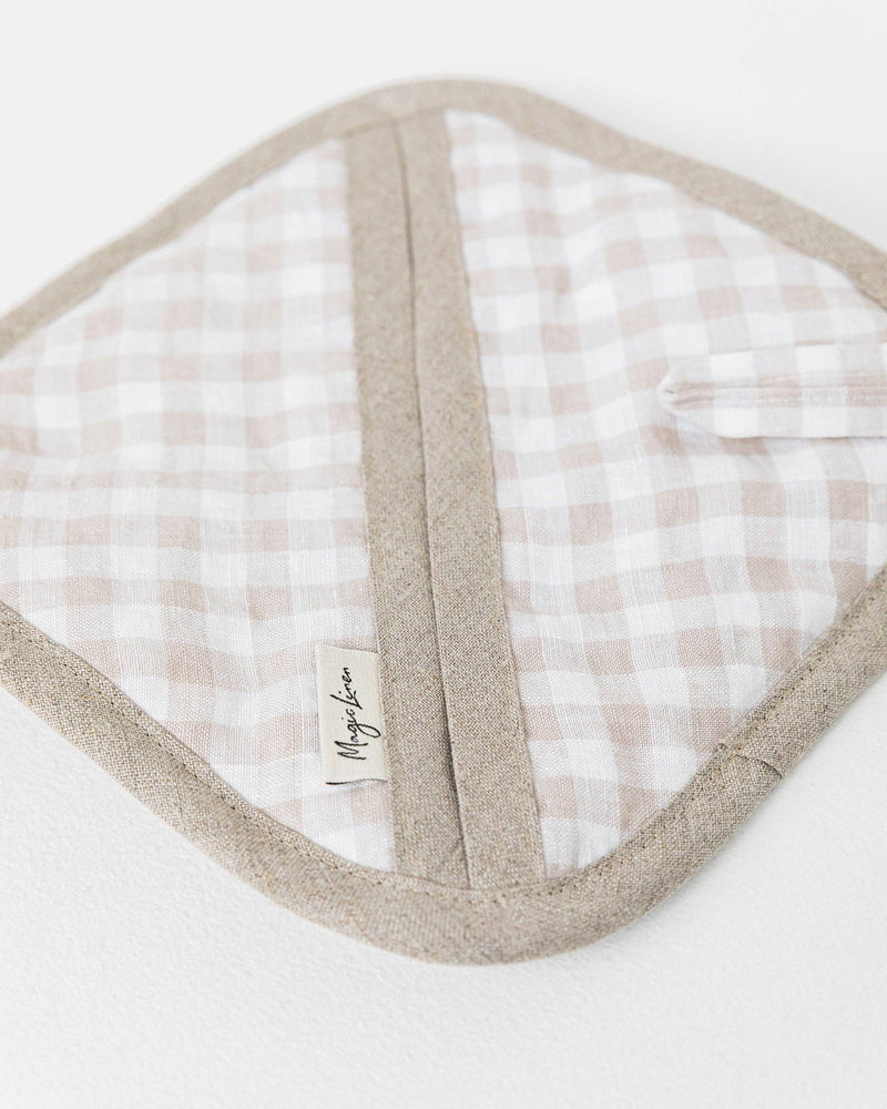MagicLinen linen pot-holder with quilted detailing and hanging loop on a white surface, ideal for kitchen use.