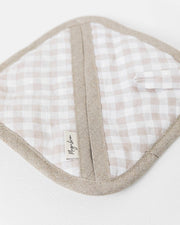 MagicLinen - Linen pot-holder with quilted detailing and hanging loop, designed for heat protection in the kitchen, displayed on a white surface.