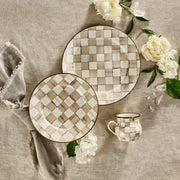 MacKenzie Childs | Mocha Check Mug on a rustic table setting with matching ceramic plates, fringed linen napkin, and scattered white blooms.