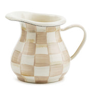 MacKenzie Childs | Mocha Check Creamer, a ceramic pitcher with a hand-painted checkerboard pattern, perfect for versatile kitchen use.