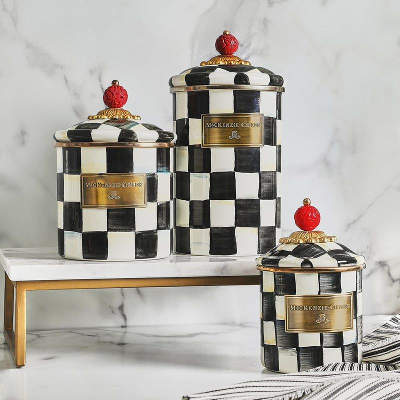 MacKenzie Childs | Courtly Check Small Canister set on a marble stand, featuring hand-painted checks and red knobs, ideal for stylish kitchen or home storage.